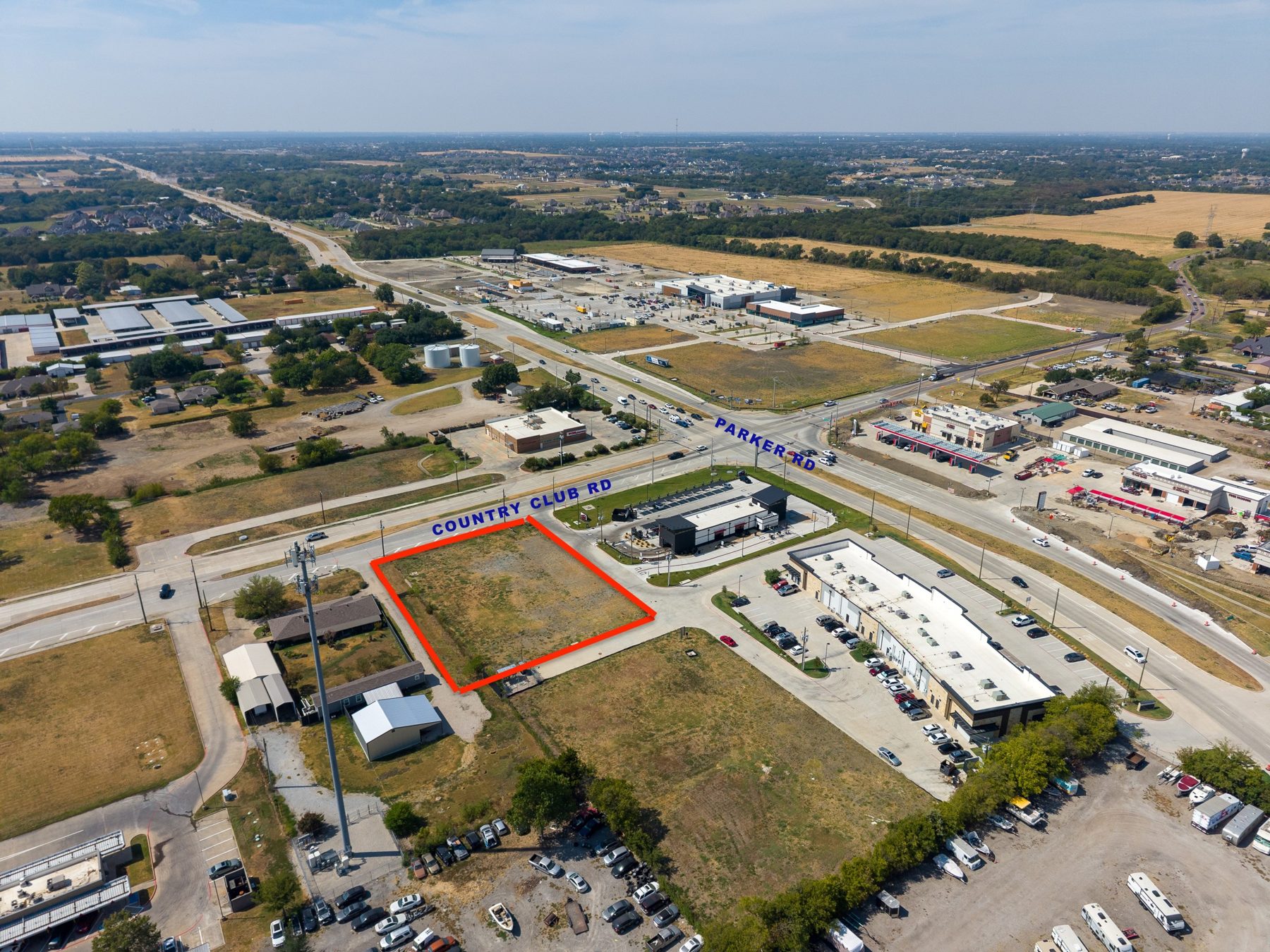 Aerial photograph, September 2026, of the 0.987-acre Lot 4 pad on FM 1378 (Country Club Rd) in Wylie, Texas, with an approximate lot outline