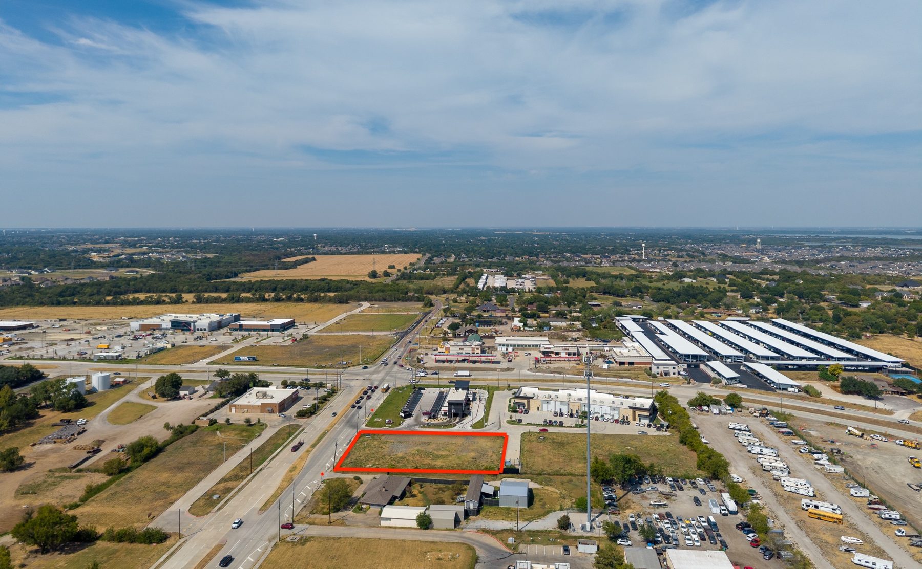 Aerial of the intersection block showing Lot 4 with an approximate lot outline