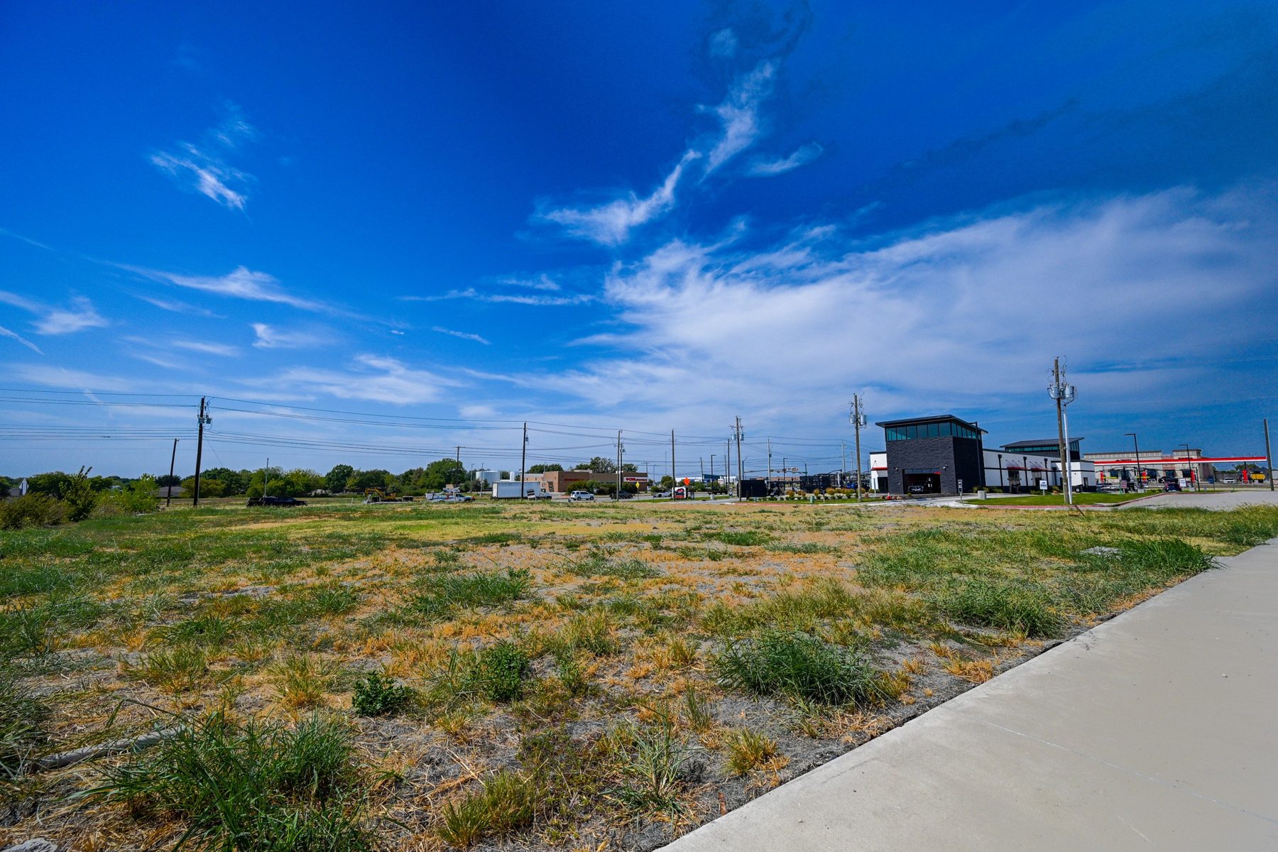 Ground-level view of the Lot 4 pad toward FM 1378